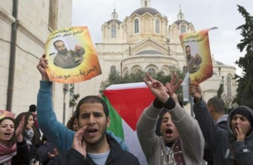 Palestinians protest in support of hunger striker 370 (photo credit: REUTERS)