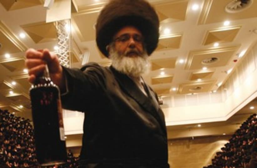 Religious men drink on Purim 370 (photo credit: REUTERS)