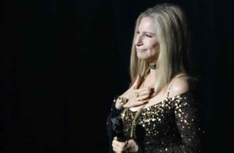 Barbra Streisand accepts  applause after performing Memories (photo credit: REUTERS/Mario Anzuoni )