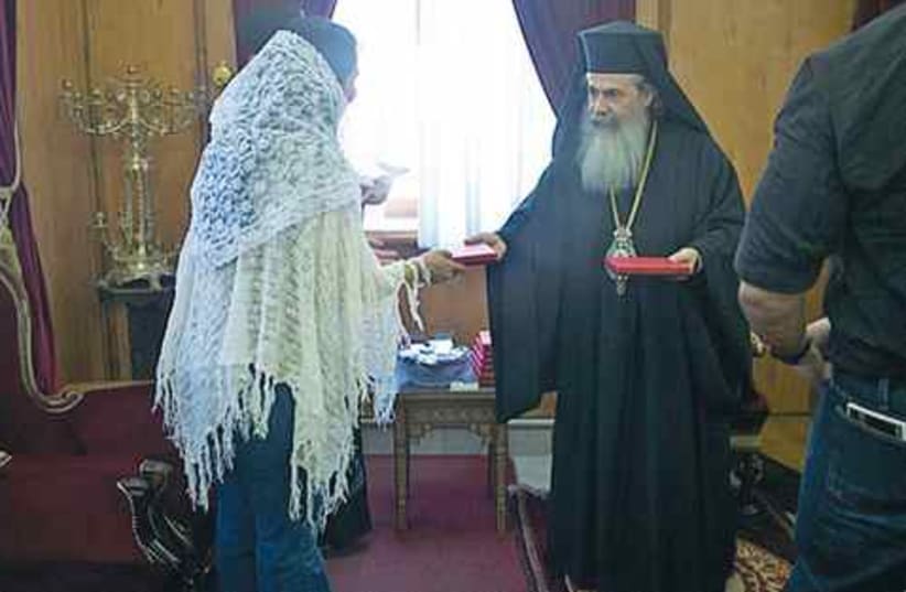 Israeli woman meets the greek patriach 521 (photo credit: JIM FLETCHER)