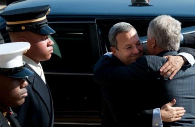 Defense Minister Barak embraces US counterpart Hagel 370 (photo credit: Courtesy Defense Ministry )