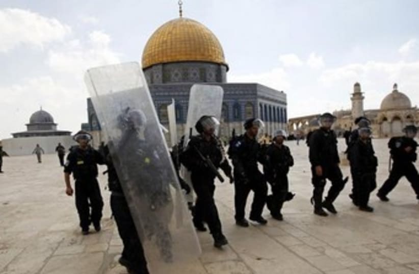Israeli police in front of Al Aqsa mosque 370 (photo credit: REUTERS/Ammar Awad)