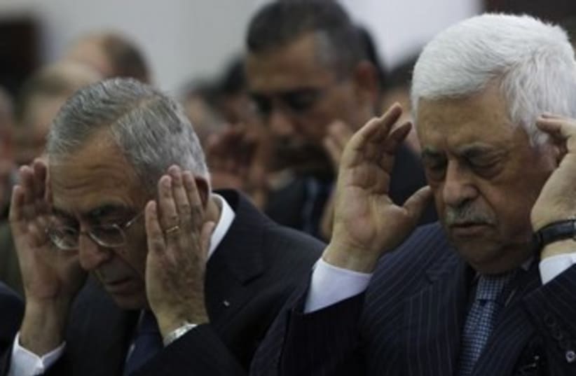 Abbas and Fayyad look like they have a headache, 370 (photo credit: REUTERS/Mohamad Torokman)