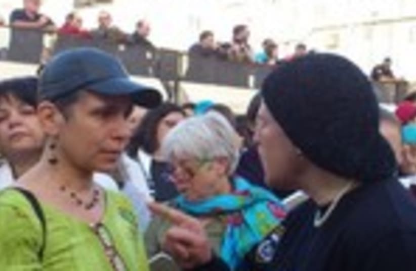 Haredi woman yells at Women of the Wall member at the Kotel  (photo credit: Melanie Lidman)