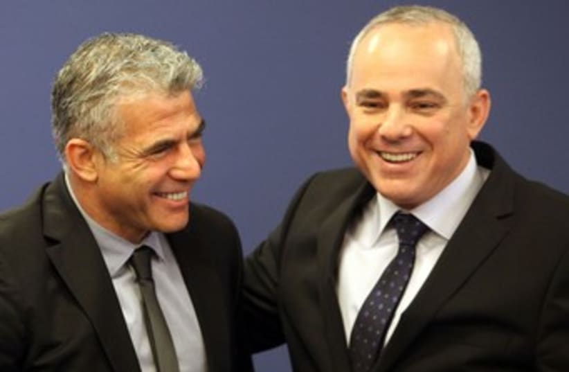 Lapid and Steinitz at Finance Ministry handover 370 (photo credit: Marc Israel Sellem/The Jerusalem Post)