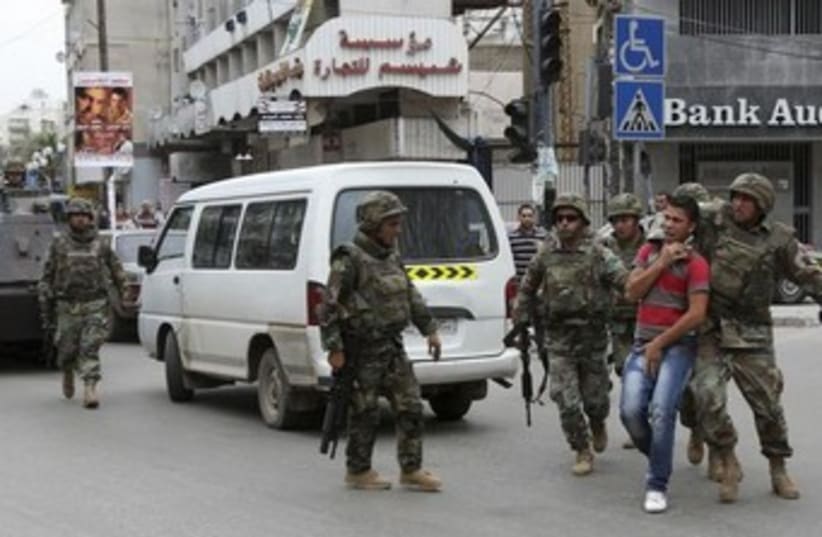 Tripoli clashes (photo credit: Reuters/omar Ibrahim)