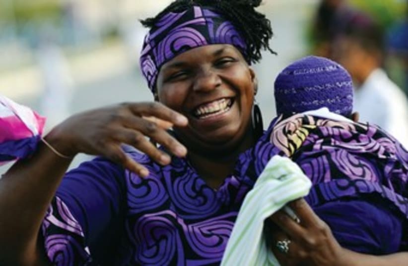 AN AFRICAN American Hebrew Israelite celebrates Passover. (photo credit: Amir Cohen/Reuters)