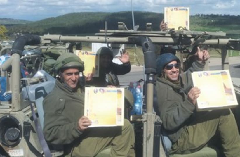 Soldiers with matzot donated 370 (photo credit: Tzvi Zelter/Hesder Yeshiva Meir Harel Modi’in)