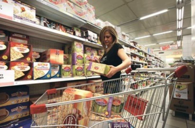 A woman shops for Passover 370 (photo credit: Marc Israel Sellem/The Jerusalem Post)