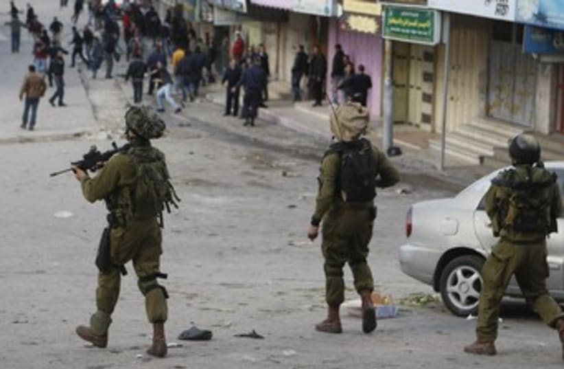IDF soldiers in Hebron (photo credit: Reuters)