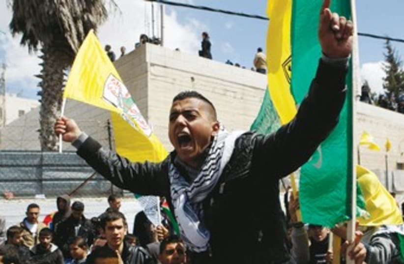 Fatah supporter Hebron 370 (photo credit: Mussa Qawasma/Reuters)