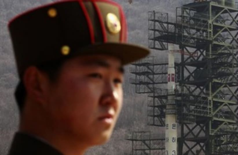 North Korean soldier, rocket (iconic) 370 (photo credit:  REUTERS/Bobby Yip )