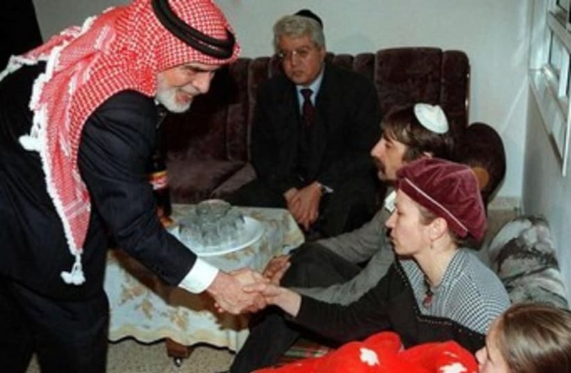 Jordan's King Hussein visits grieving familes 370 (photo credit: REUTERS)