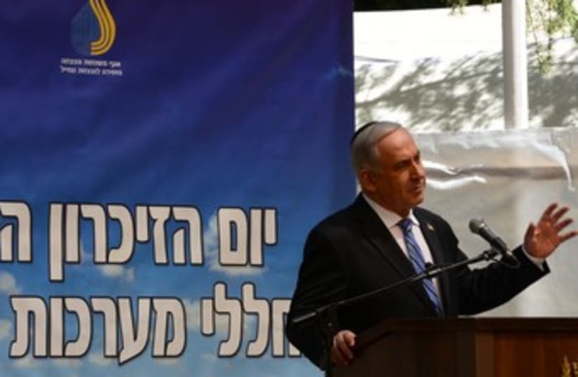 Prime Minister Binyamin Netanyahu at Yom Hazikaron ceremony  (photo credit: Marc Israel Sellem/The Jerusalem Post)