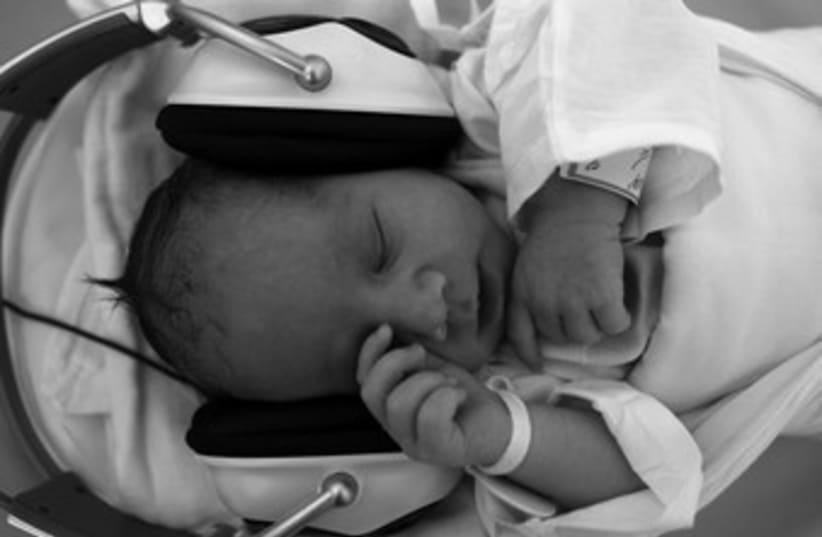 Baby with headphones 370 (photo credit: reuters)