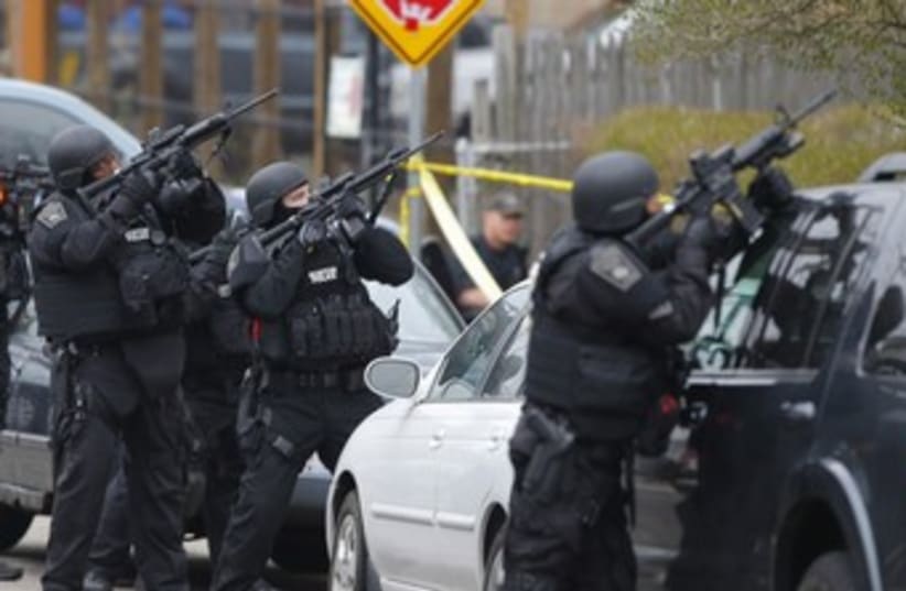Police during Boston bomber manhunt 370 (photo credit: REUTERS/Brian Snyder)