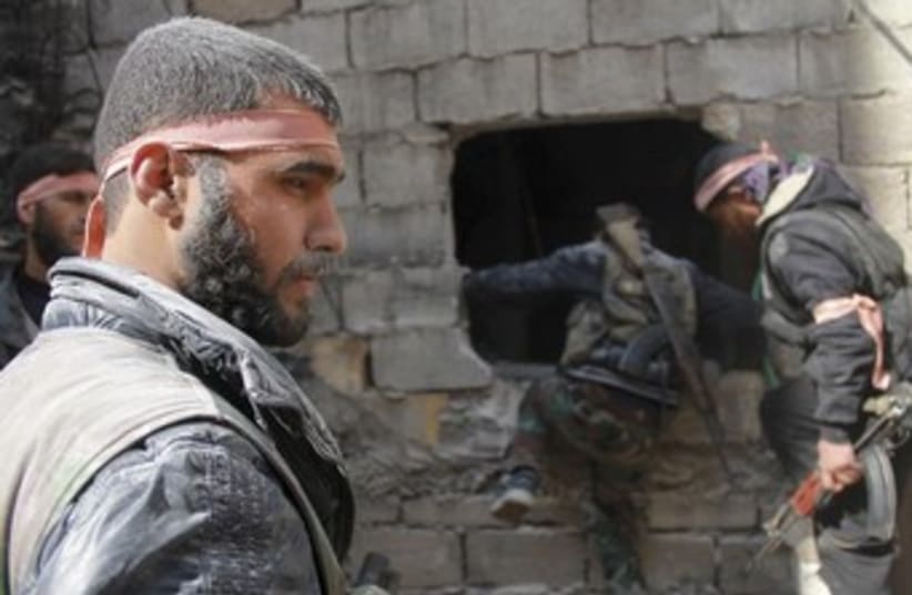 Free Syrian Army fighters in Jdeidet al Fadel 370 (photo credit: REUTERS/Malek Al Shemali)