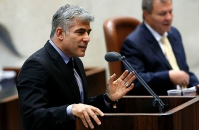 Lapid speaking at the Knesset 370 (photo credit: Marc Israel Sellem/The Jerusalem Post)