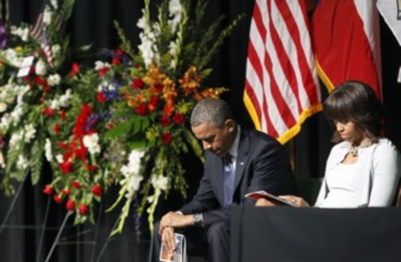 Obama and first lady in mourning 370 (photo credit: REUTERS)