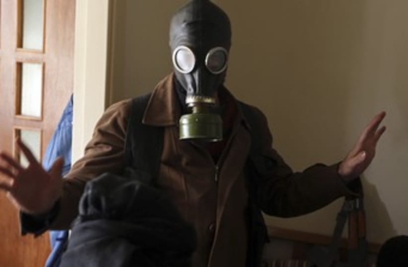 Syrian free army gas mask370 (photo credit: REUTERS/Goran Tomasevic)
