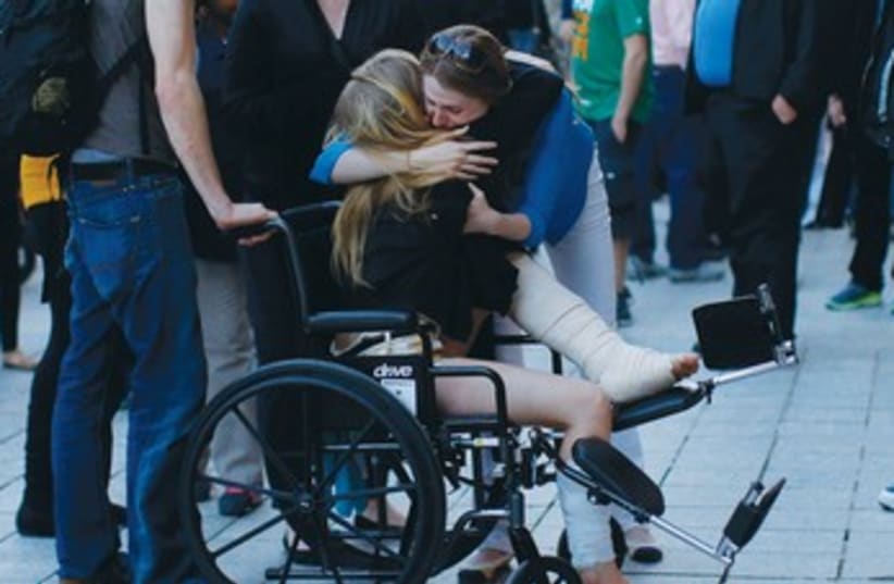 Boston bombing victim wheelchair 370 (photo credit: REUTERS)