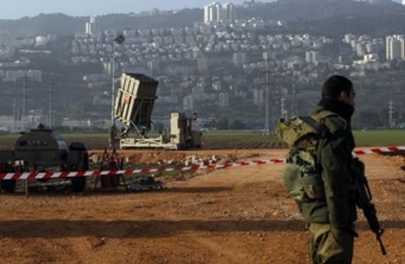 Iron Dome and soldier 370 (photo credit: Reuters)