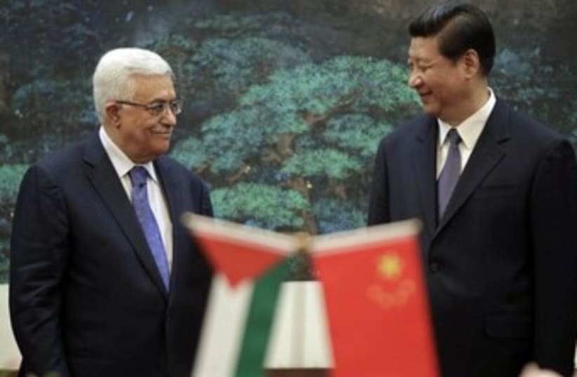 China's President Xi Jinping (R) and his Palestinian counter (photo credit: REUTERS/Jason Lee)