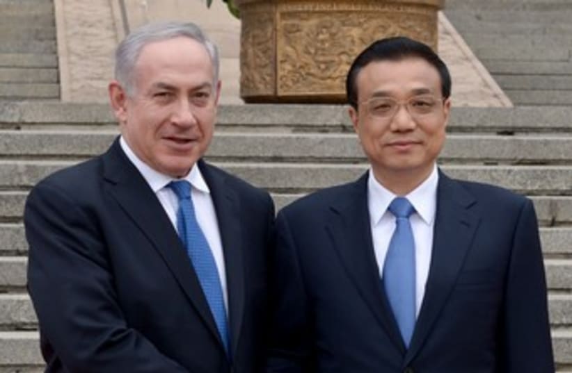Netanyahu and Chinese PM Li Keqiang 370  (photo credit: Avi Ohayon/GPO)