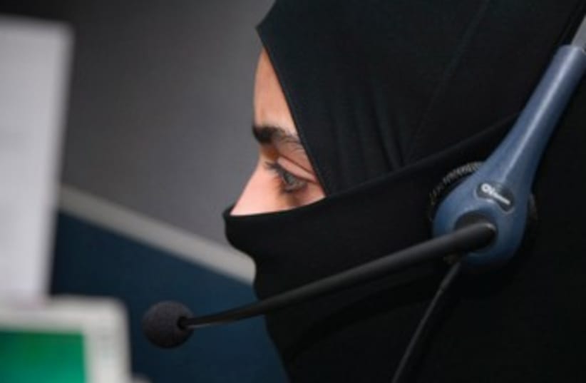 A WOMAN working in a bank in Saudi Arabia 370 (photo credit: REUTERS)