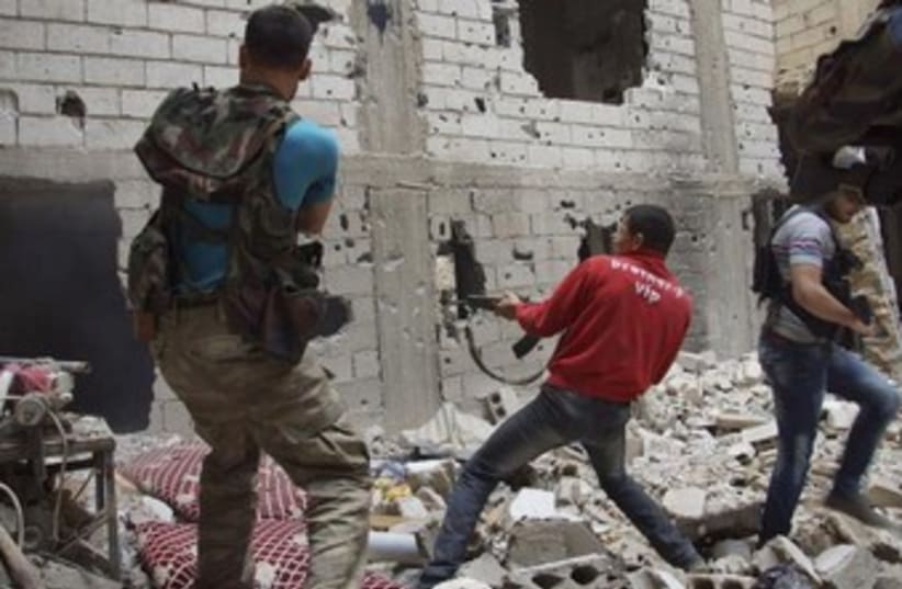firefight in syria 370 (photo credit: REUTERS)