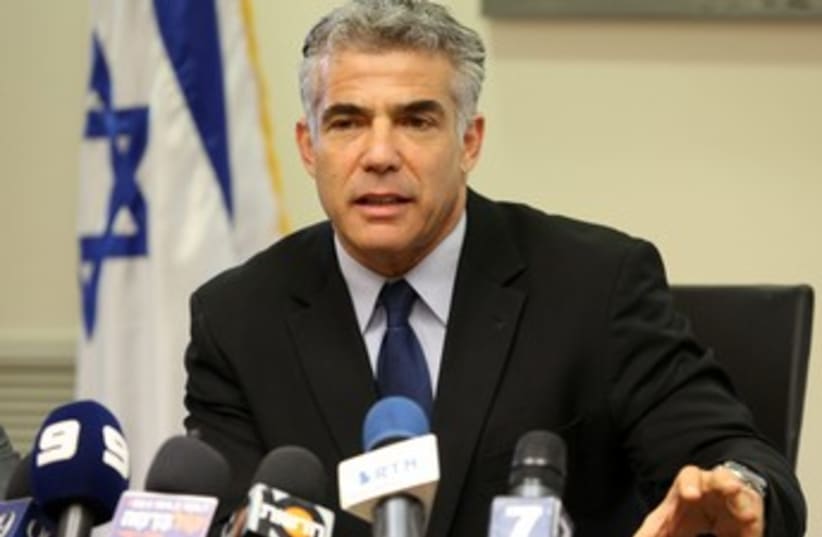 Yair Lapid at Cabinet Meeting, looking official 370 (photo credit: Marc Israel Sellem/The Jerusalem Post)