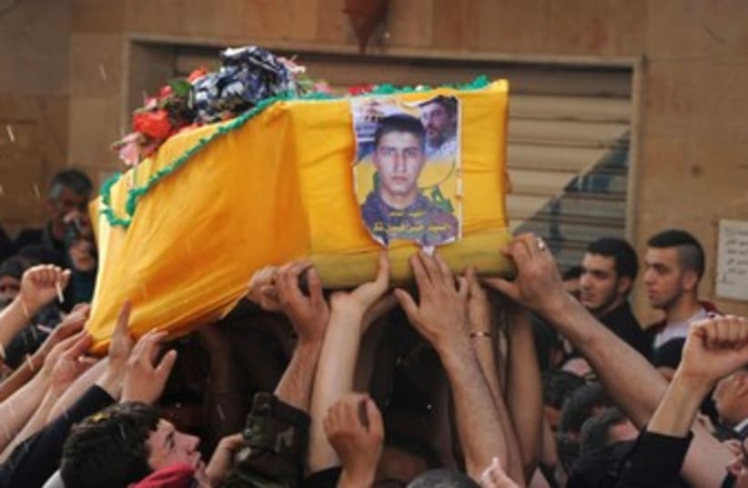 Hezbollah coffin in Syria (photo credit: REUTERS)