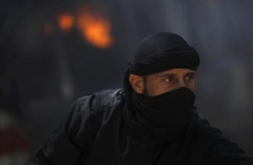 Islamist Nusra Front fighter in Syria 370 (photo credit: REUTERS)