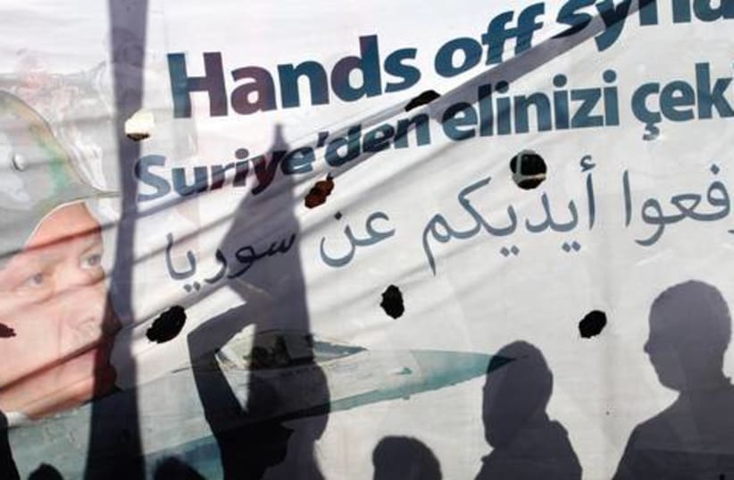 Hands off Syria521 (photo credit: UMIT BEKTAS / REUTERS)