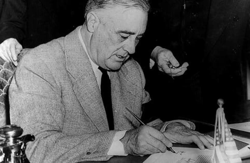 WWII Roosevelt Signing Declaration of War521 (photo credit: US Library of Congress)