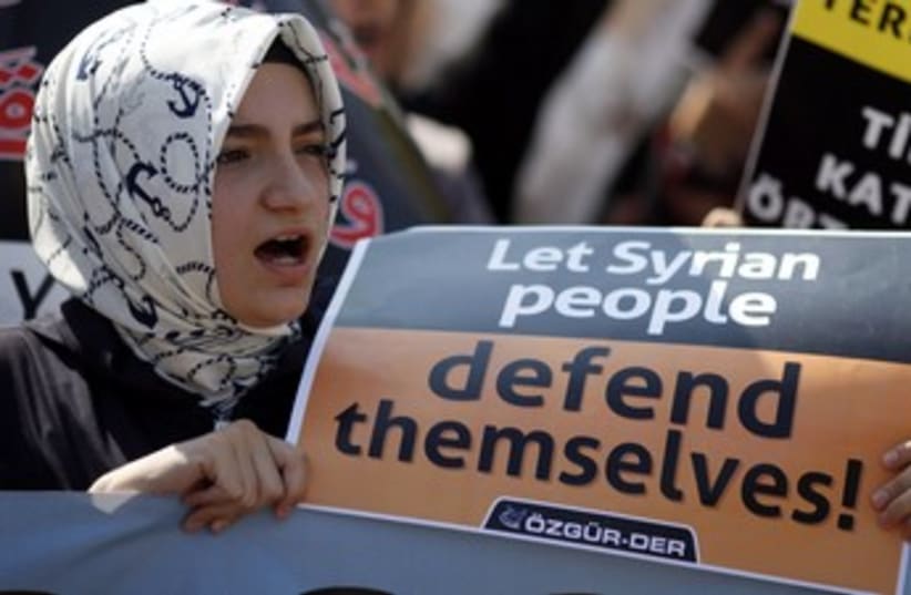Woman shouts slogans during protest against Assad 370 (photo credit: REUTERS/Osman Orsal)