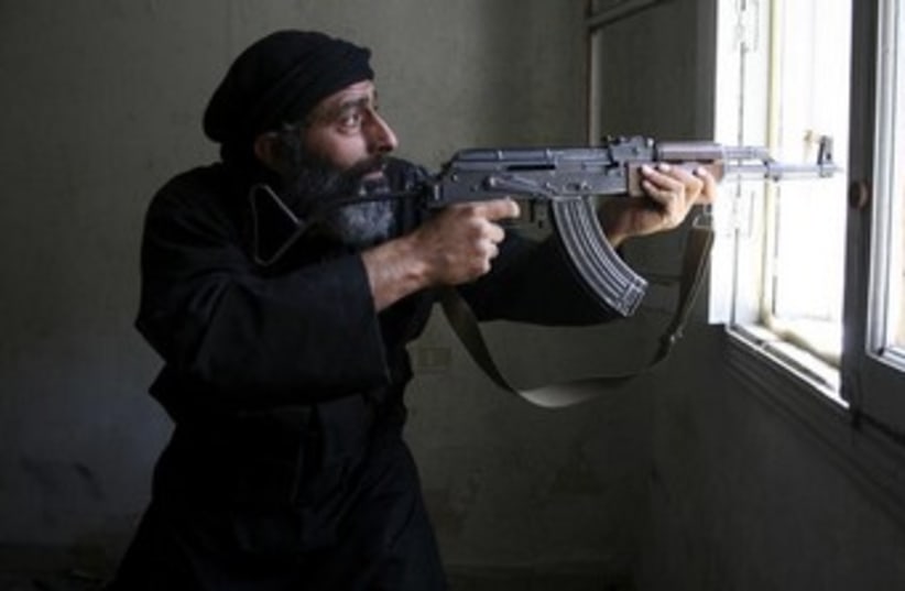 Free Syrian Army fighter 370 (photo credit: REUTERS/Aref Hretani)