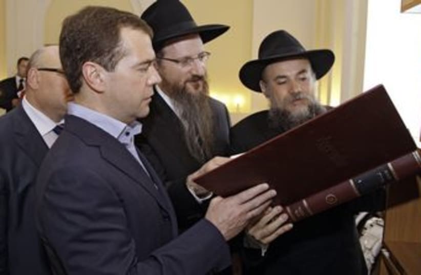 Medvedev, Lazar, Boroda in library of Freud Jewish Community (photo credit: reuters )