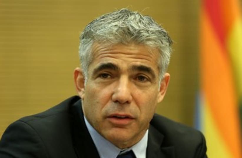 Yair Lapid with gay flag 370 (photo credit: Yair Lapid at meeting in Knesset, 3 June 2013.)