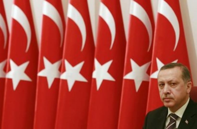 Tayyip Erdogan with flags 370 (photo credit: REUTERS/Umit Bektas )