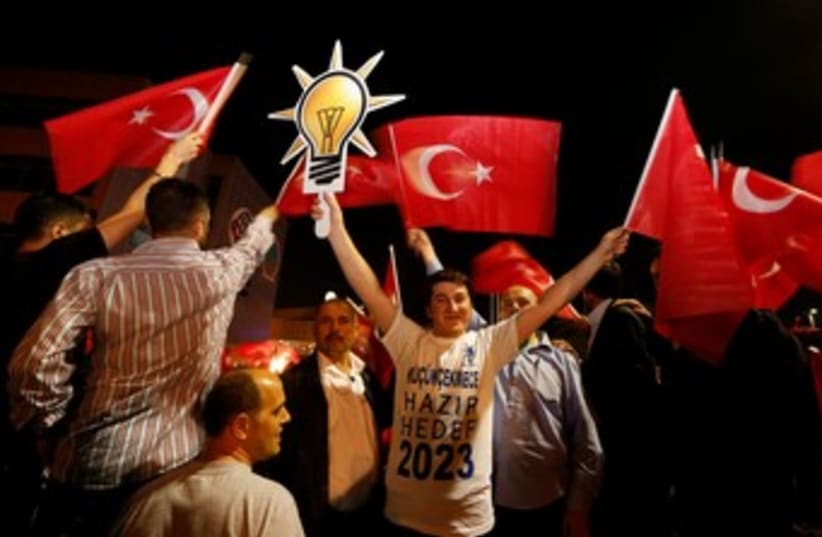 Supporters of  Erdogan wave flag 370 (photo credit: REUTERS)
