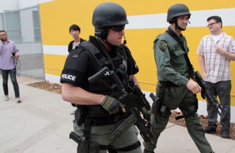 SWAT officers at scene of LA shooting 370 (photo credit: REUTERS)