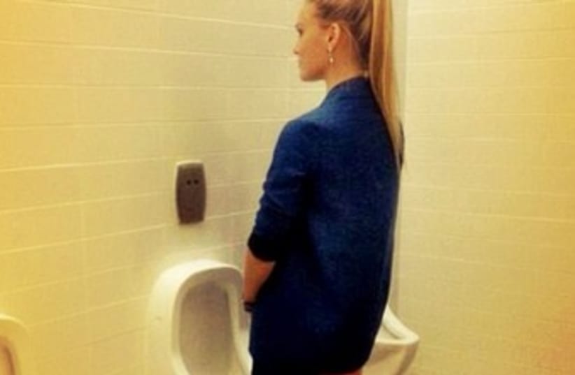 Bar Refaeli posing in front of urinal 370 (photo credit: Instagram)