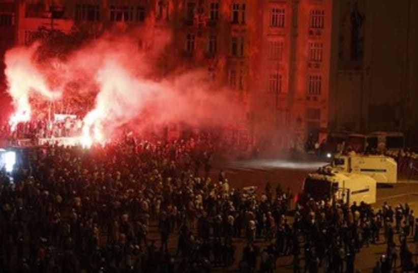turkey protests night flares 370 (photo credit: REUTERS)
