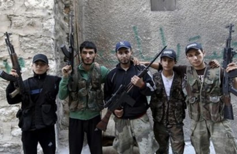 rebel fighters pose 370 (photo credit: REUTERS)