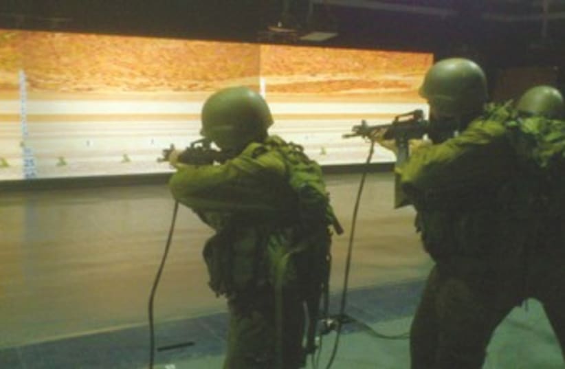 IDF soldiers shoot at simulation 370 (photo credit: Yaakov Lappin)