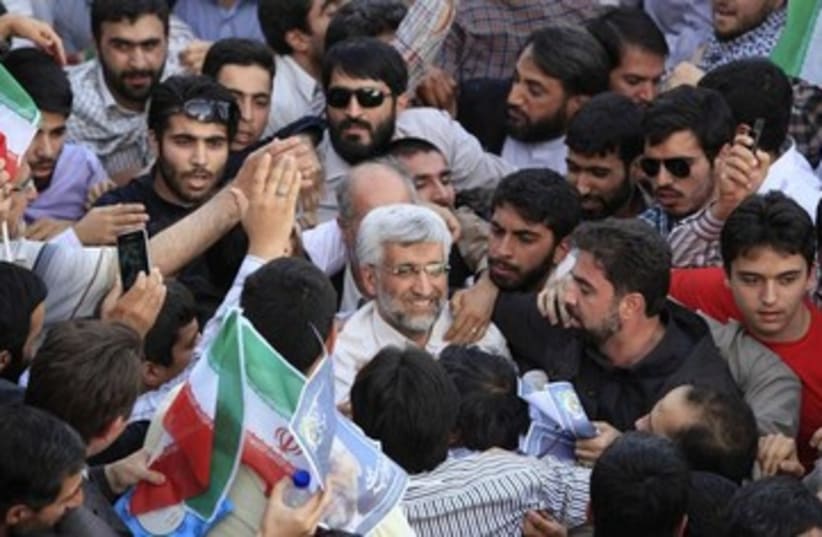 Iranian presidential hopeful Jalili with supporters 370 (photo credit: REUTERS)
