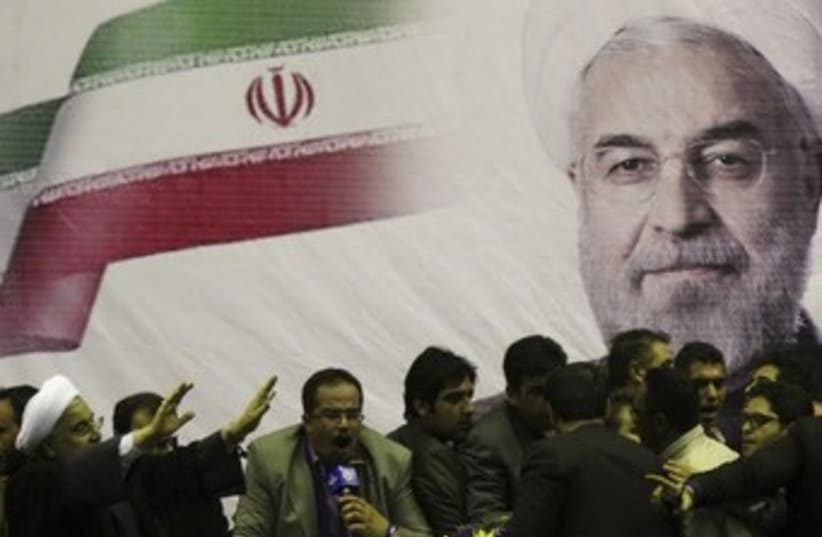 Iranian presidential candidate Hassan Rohani (L) mural 370 (photo credit: REUTERS)