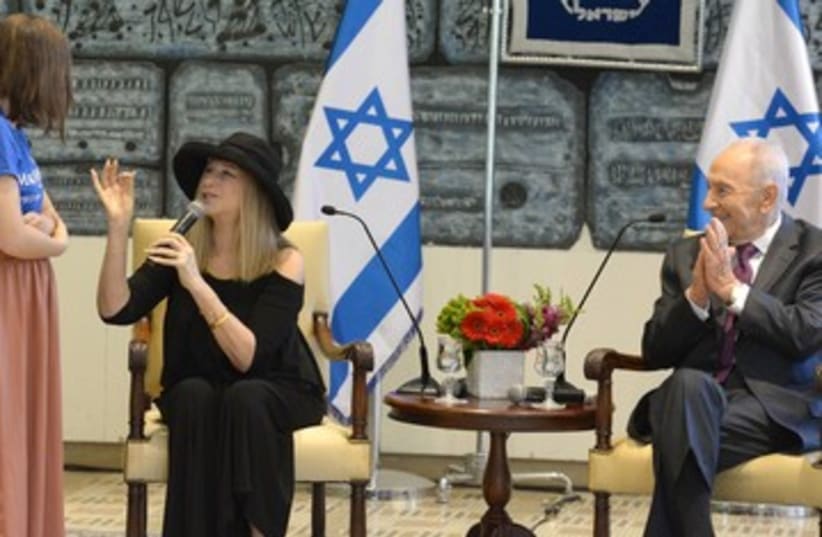 Streisand and Peres with Make a Wish children 370 (photo credit: Mark Neiman/GPO)