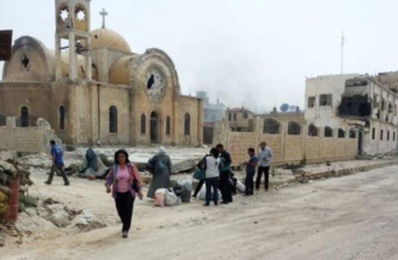 rubble in Qusair 370 (photo credit: REUTERS)